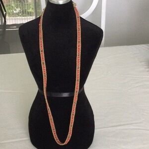 Woman’s Beaded Necklace color Red with a few dark beads a fun Necklace